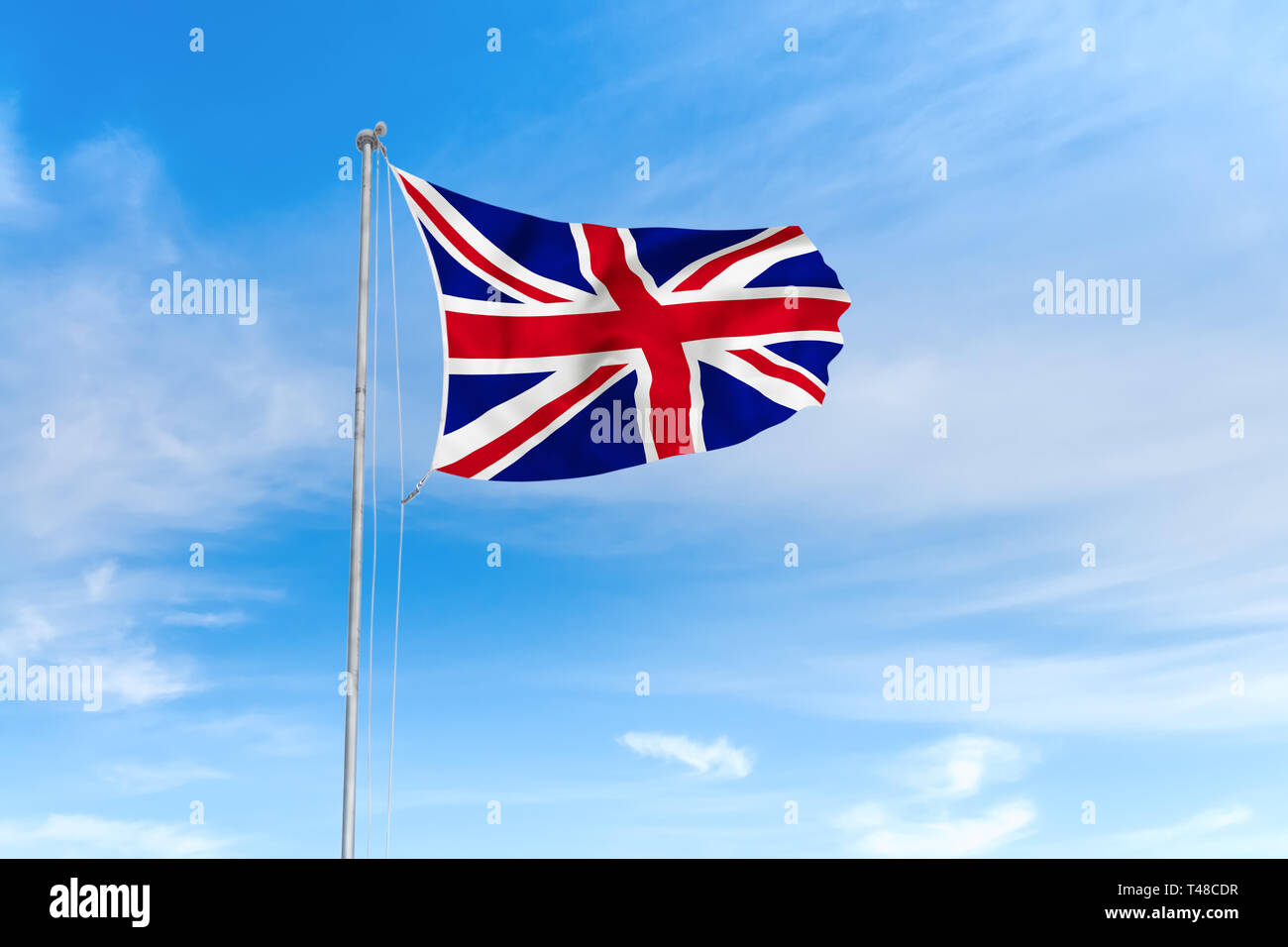 Vereinigtes Königreich von Großbritannien und Nordirland Flagge weht im Wind über blauen Himmel Hintergrund Stockfoto