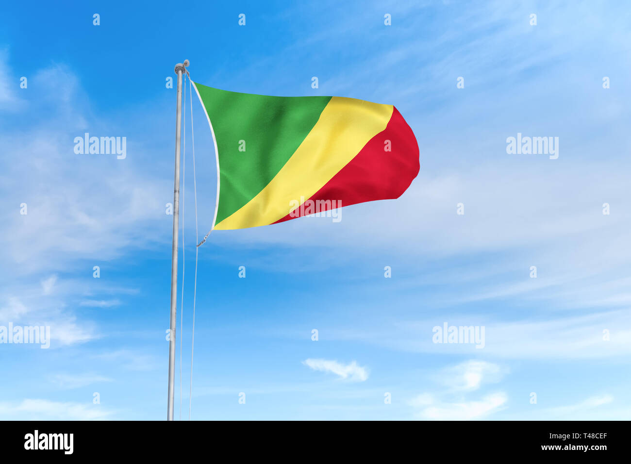 Kongo Flagge weht im Wind über blauen Himmel Hintergrund Stockfoto