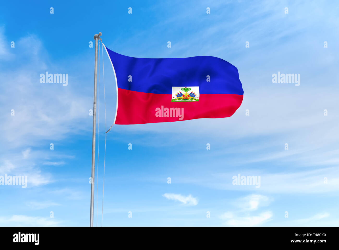 Haiti Flagge weht im Wind über blauen Himmel Hintergrund Stockfoto