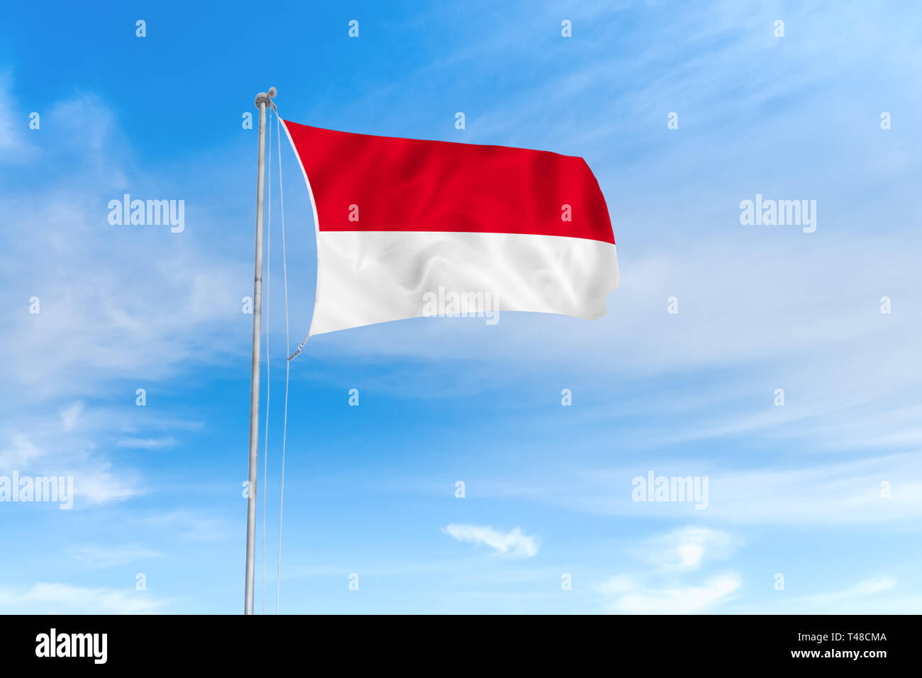 Indonesien Flagge weht im Wind über blauen Himmel Hintergrund Stockfoto