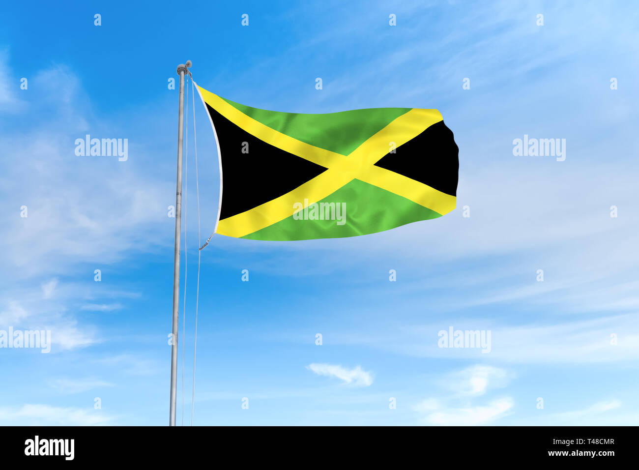 Jamaika Flagge weht im Wind über blauen Himmel Hintergrund Stockfoto