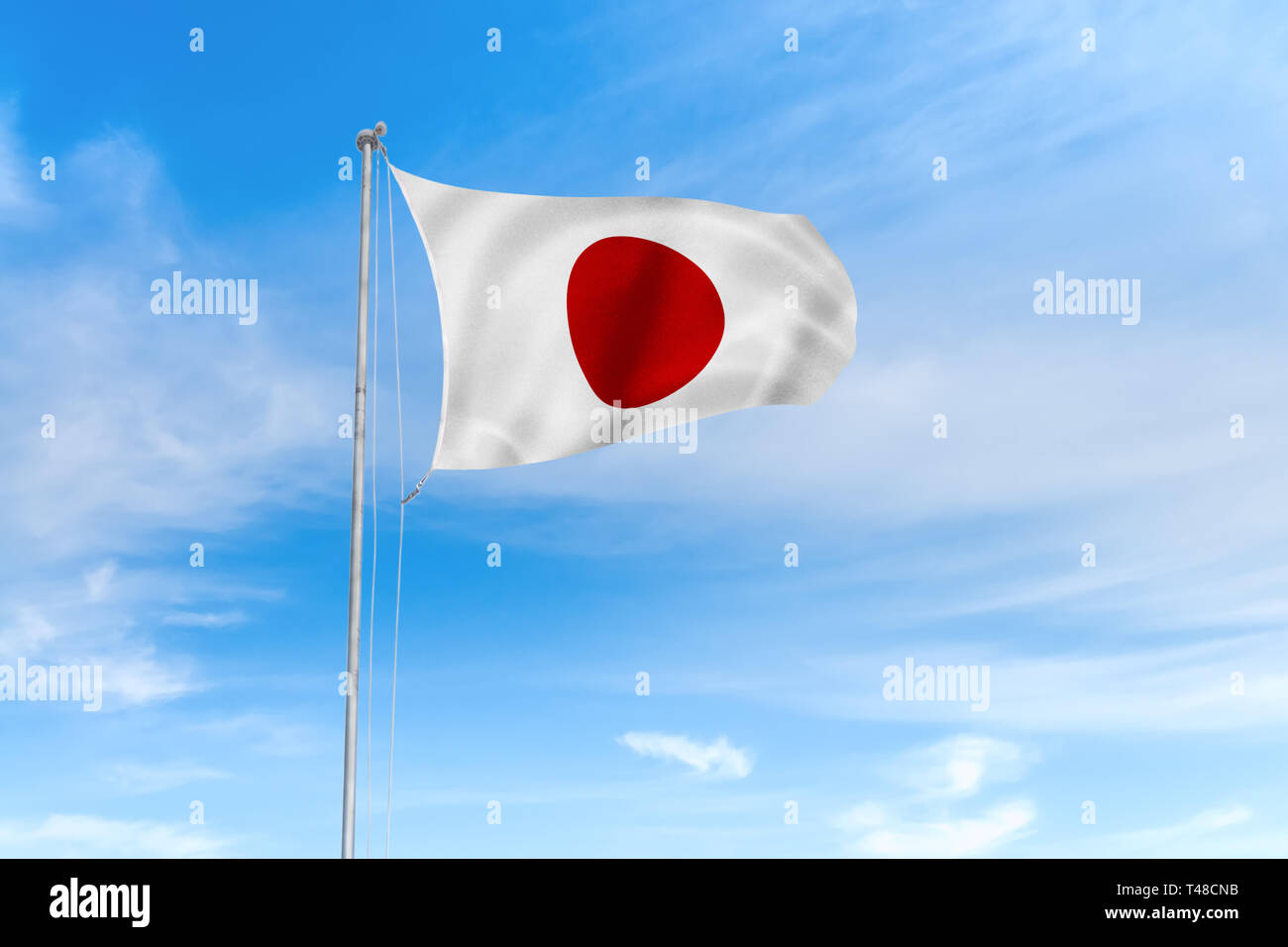 Japan Flagge weht im Wind über blauen Himmel Hintergrund Stockfoto