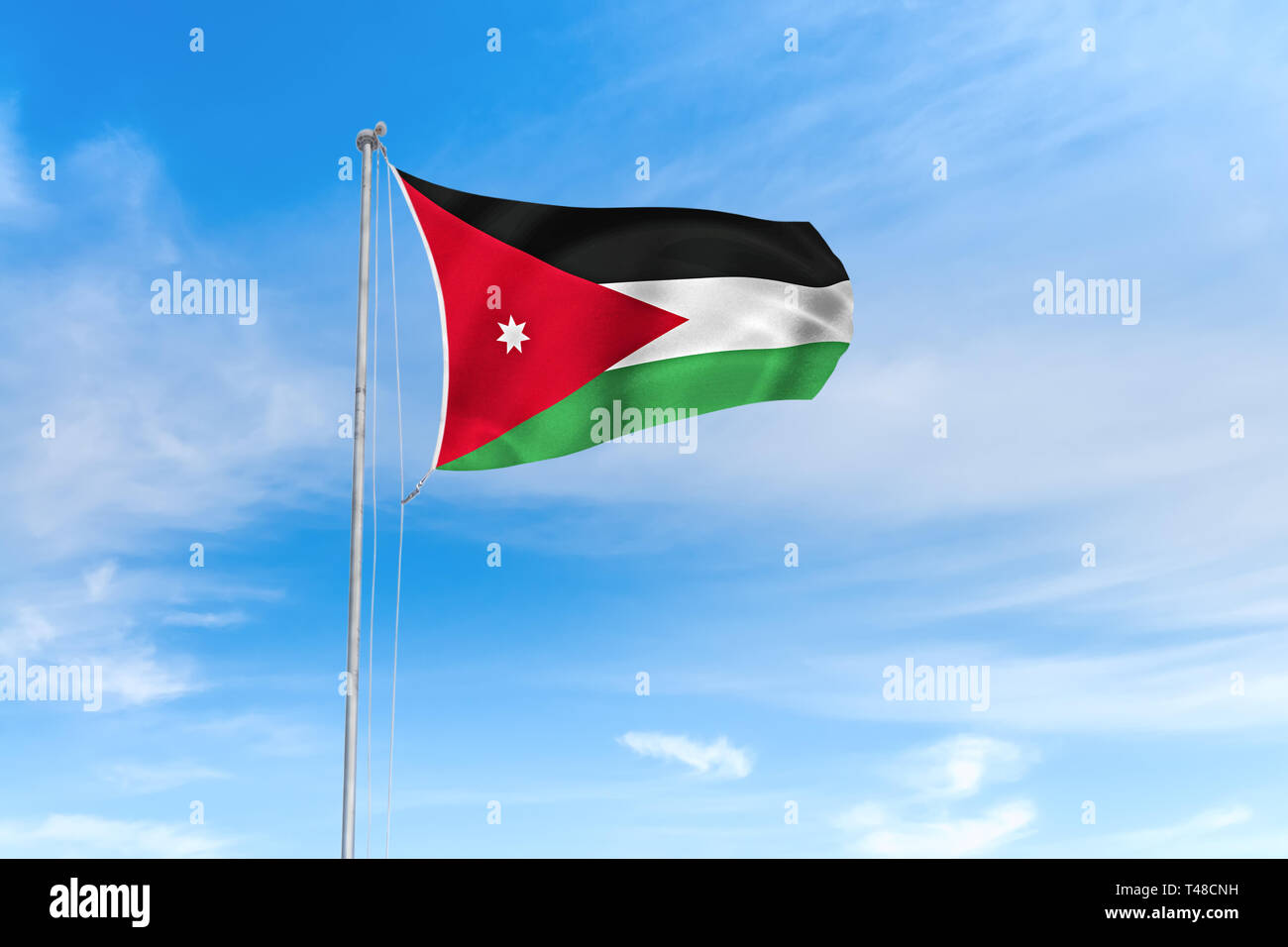 Jordanien Flagge weht im Wind über blauen Himmel Hintergrund Stockfoto