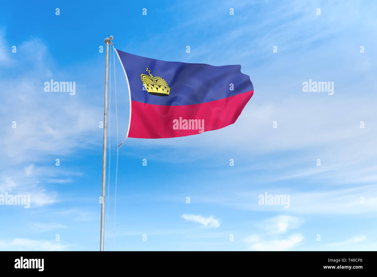Liechtenstein Flagge weht im Wind über blauen Himmel Hintergrund Stockfoto