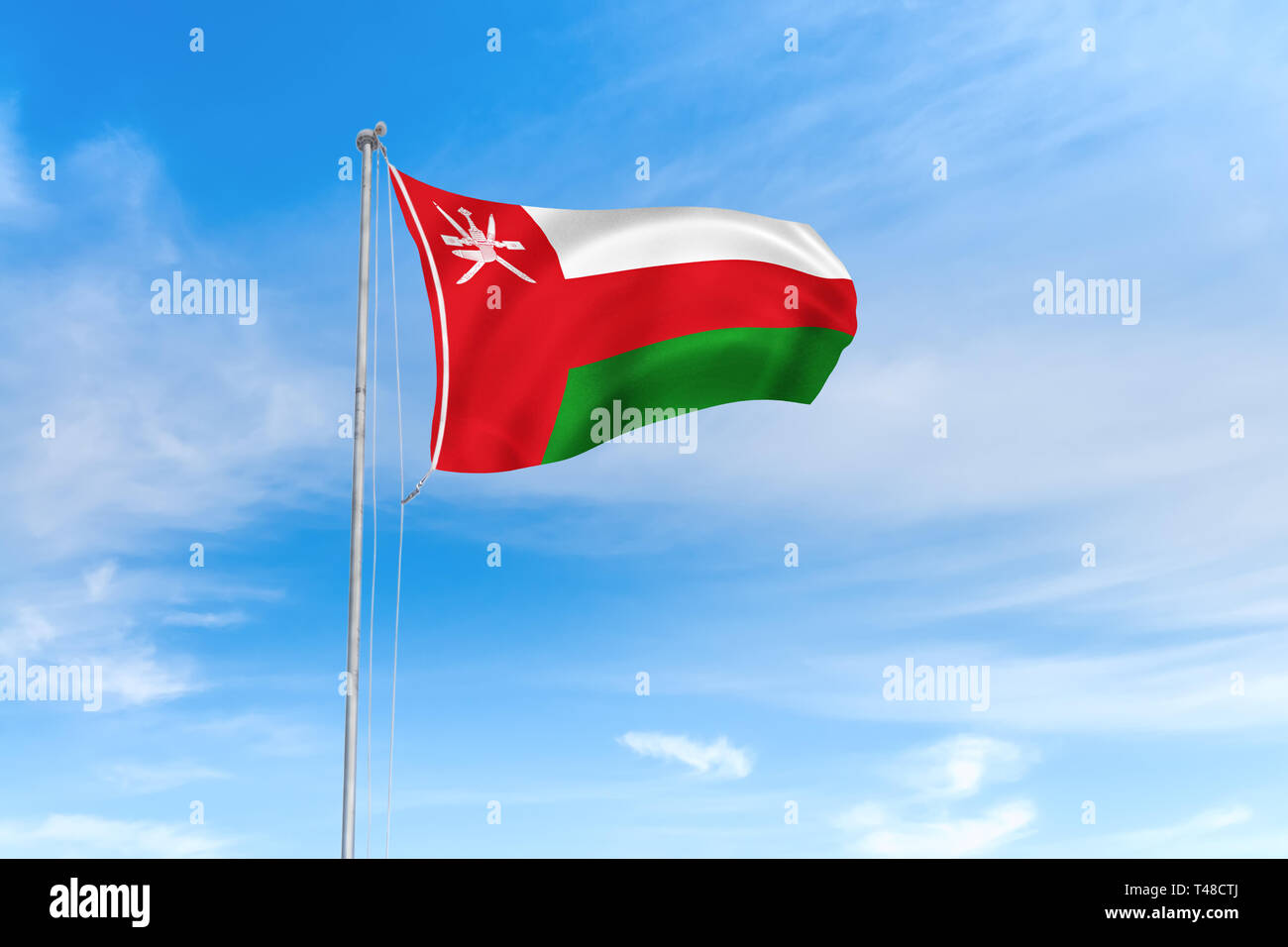 Oman Flagge weht im Wind über blauen Himmel Hintergrund Stockfoto