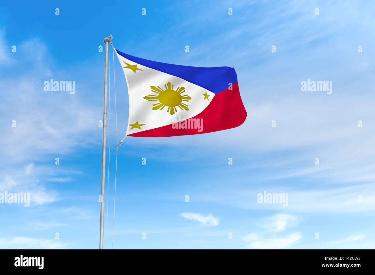 Philippinen Flagge weht im Wind über blauen Himmel Hintergrund Stockfoto