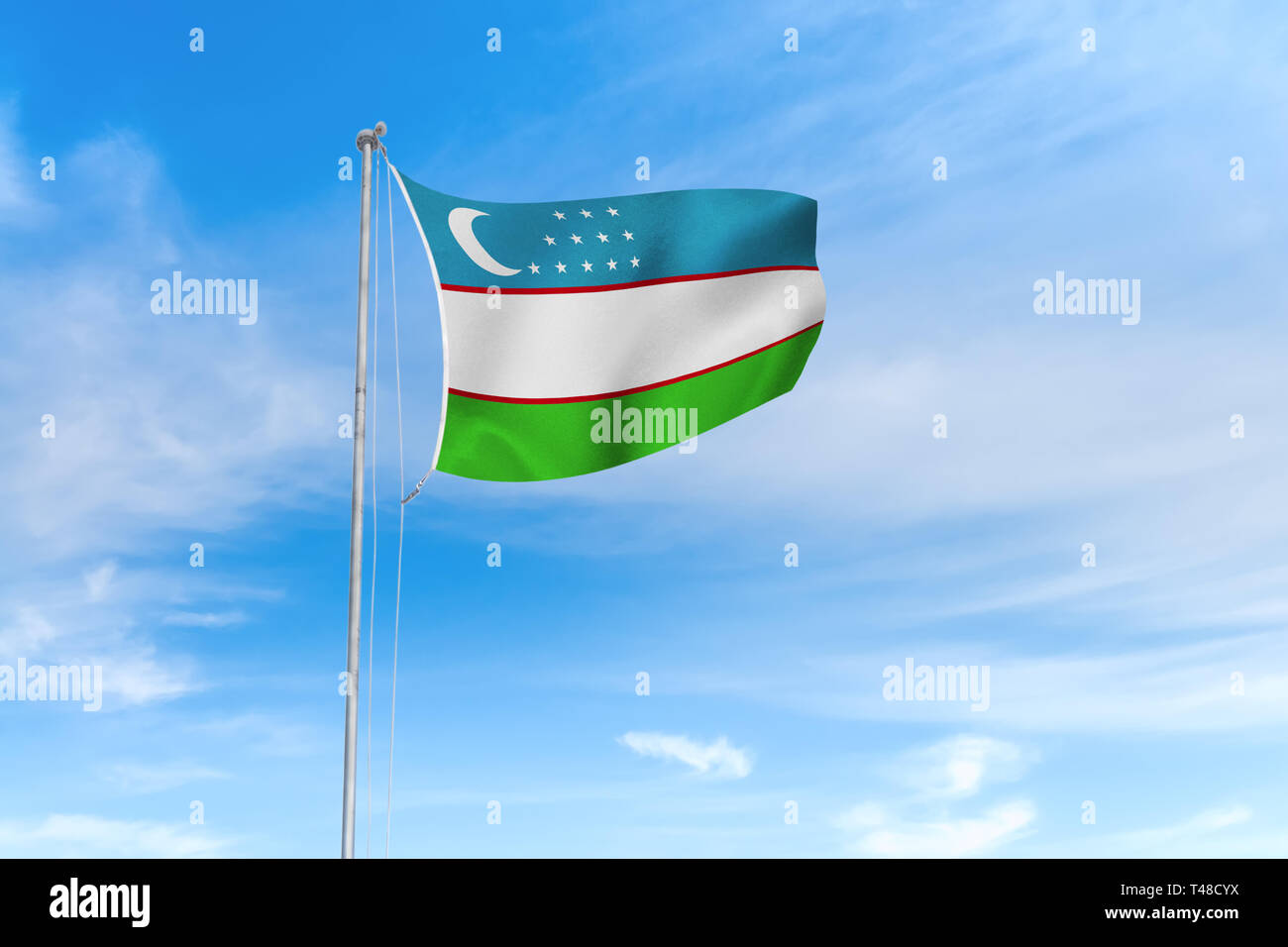 Usbekistan Flagge weht im Wind über blauen Himmel Hintergrund Stockfoto