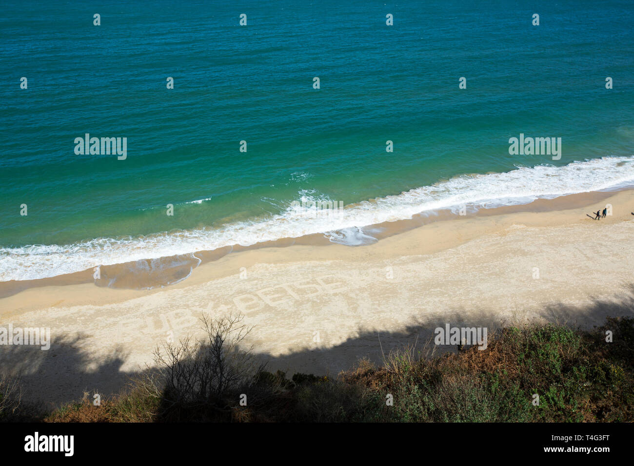 Namen in den Sand am Strand Carbis geschrieben, in der Nähe von St Ives, Cornwall, UK. Stockfoto