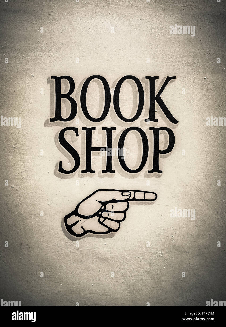 Vintage Buch Shop Schild mit einer zeigenden Hand Stockfoto