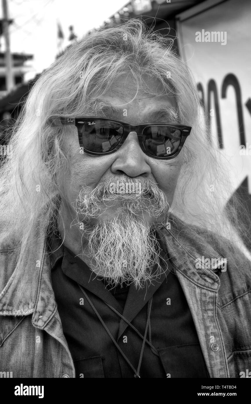 Thailand Mann. Reifen asiatischer Mann mit Bart und langes Haar Stockfoto
