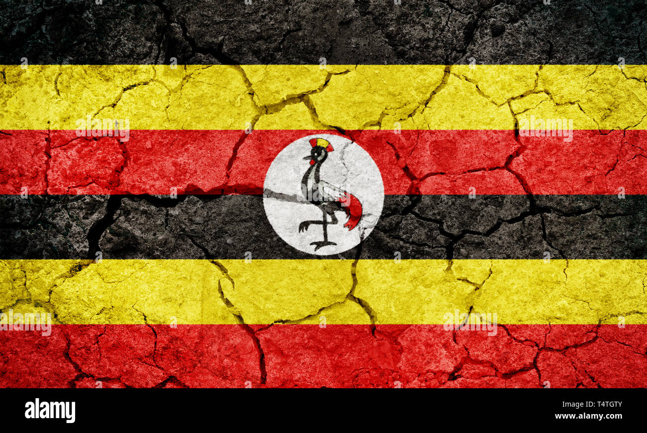 Republik Uganda Flagge auf trockener Erde Boden Textur Hintergrund Stockfoto