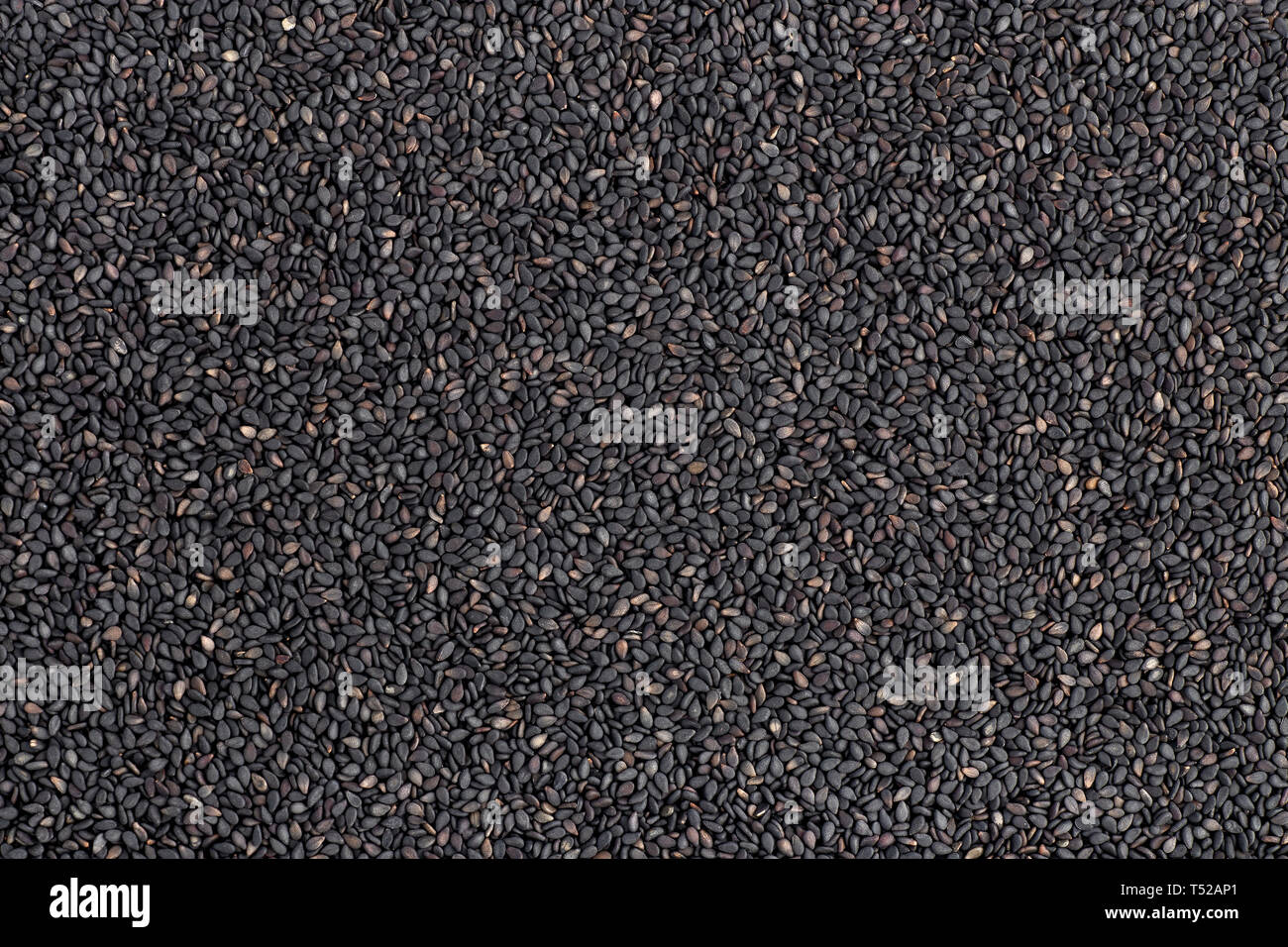 Schwarzer Sesam als Hintergrund Stockfoto