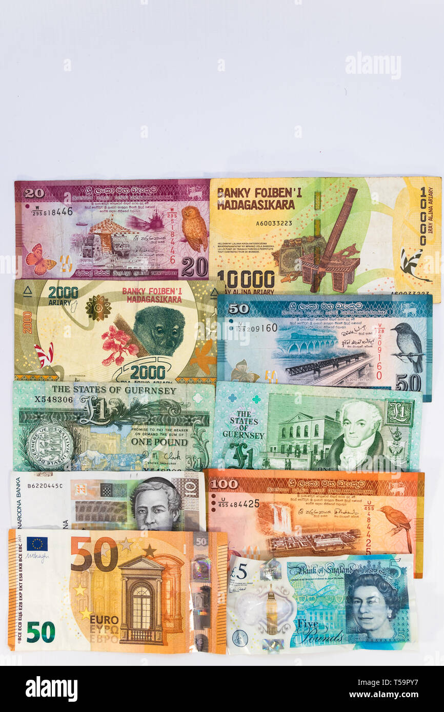 Banknoten Hintergrund mit Währung von Guernsey, Madagaskar, Kroatien, Großbritannien, Sri Lanka und Europa mit kopieren. Stockfoto