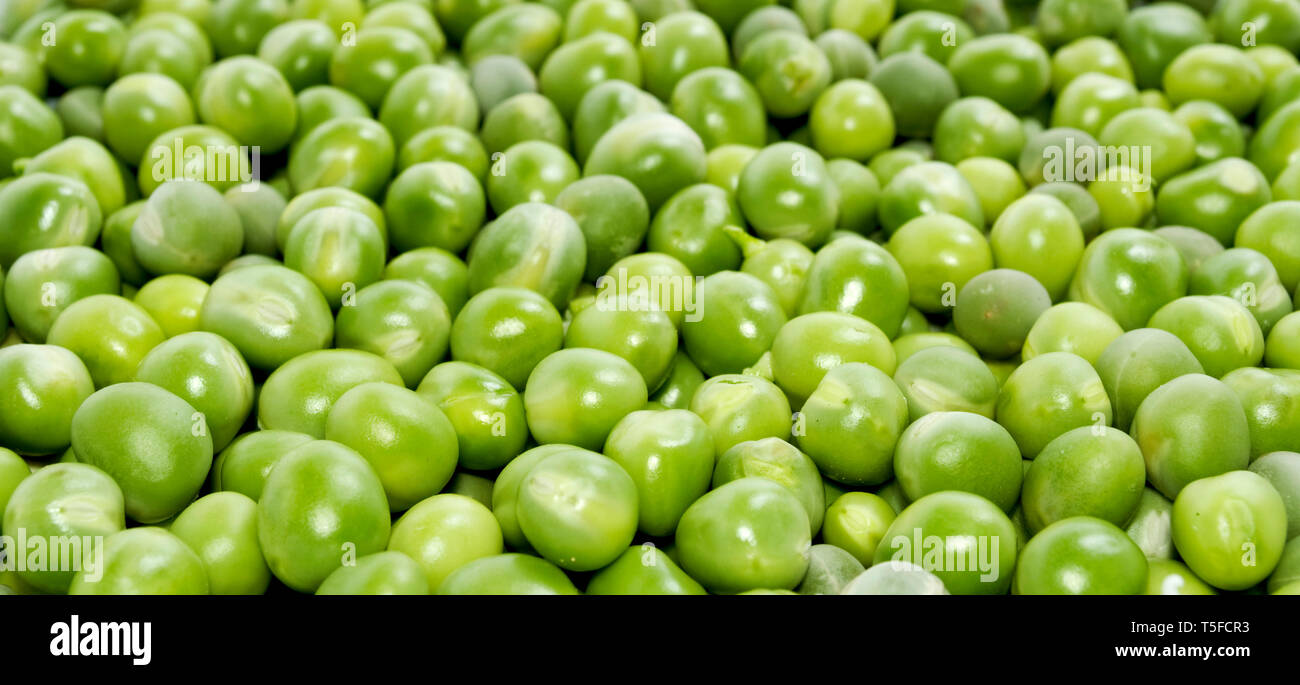 Grüne Erbsen-Hintergrund Stockfoto