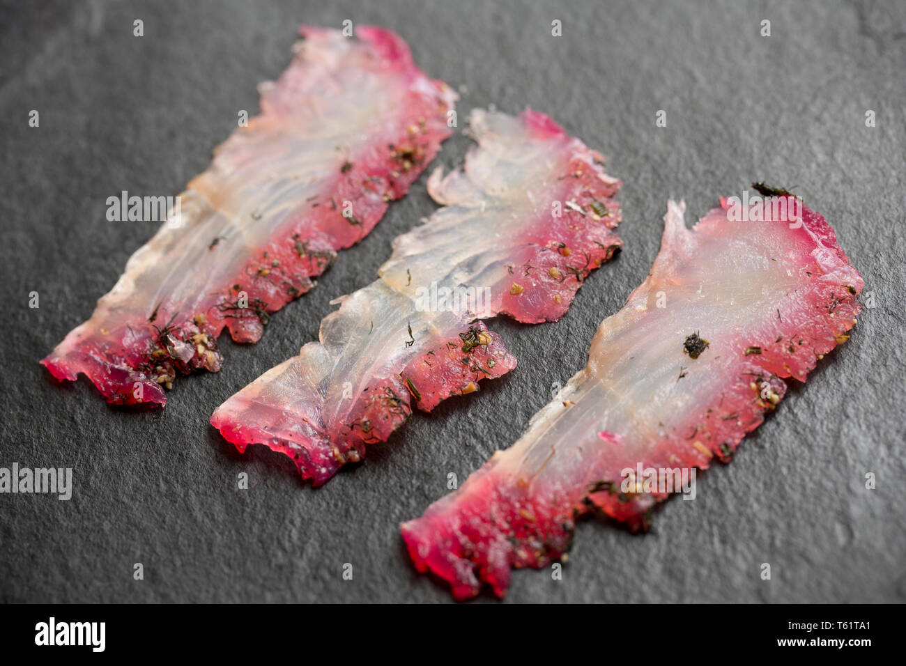 Schichten aus einem seelachsfilet, pollachius pollachius, aus einem Fisch, die auf der Stange und Line in den Englischen Kanal vom Boot aus gefangen wurde. Es ist benutzt worden Stockfoto