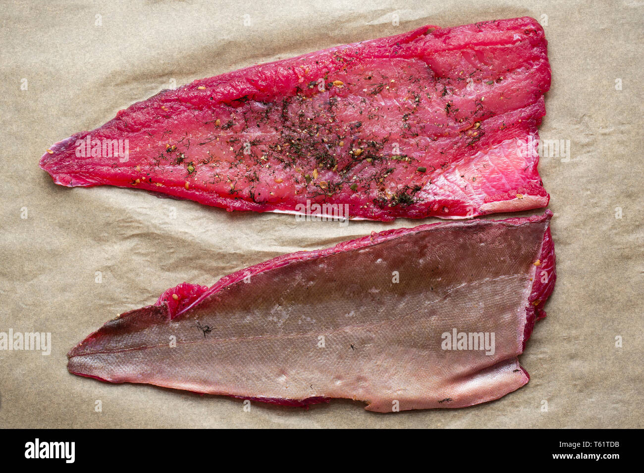 Zwei Filets, Pollack pollachius pollachius, aus einem Fisch, die auf der Stange und Line in den Englischen Kanal vom Boot aus gefangen wurde. Es wurde verwendet, um Uhr machen Stockfoto