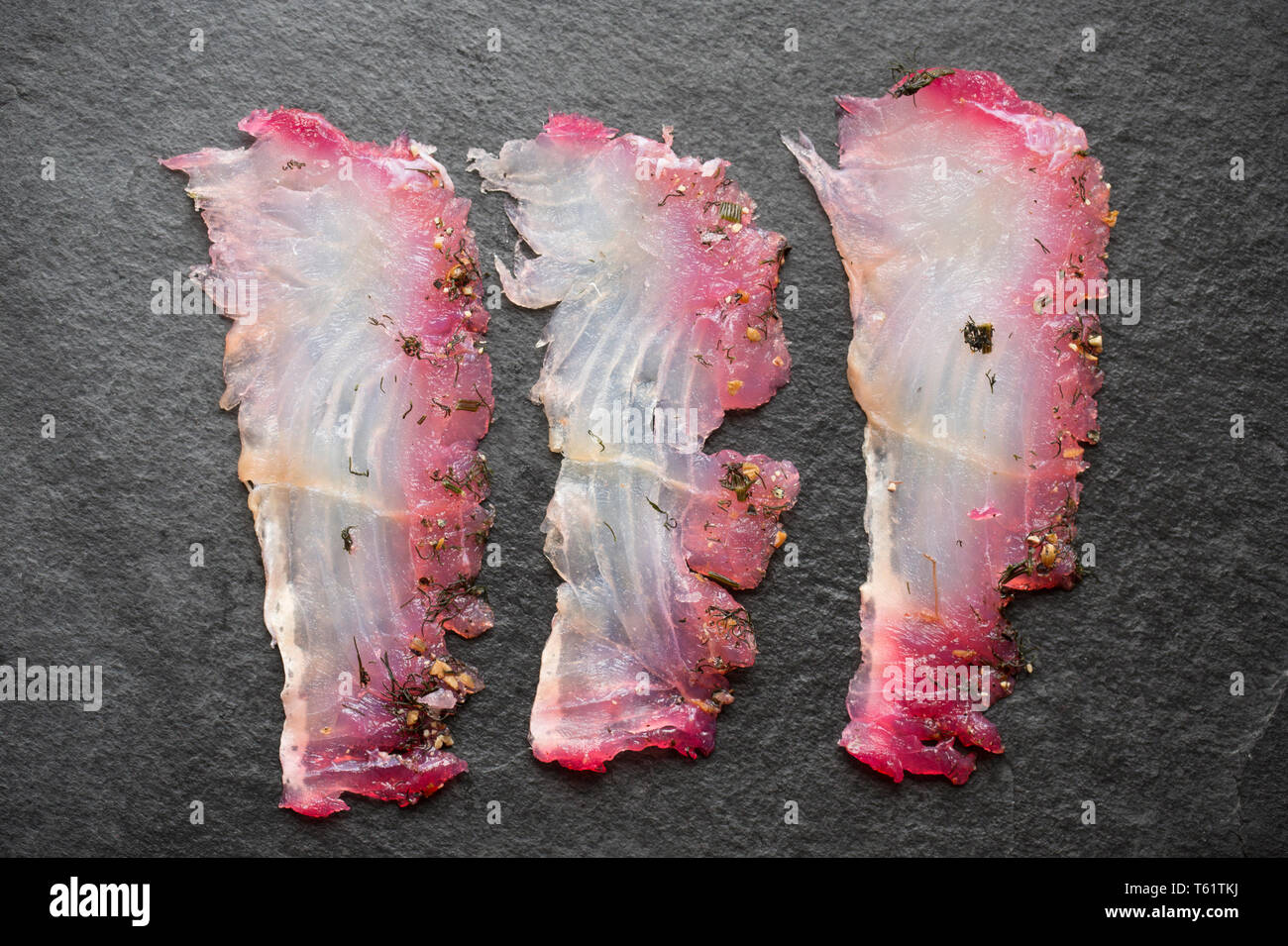 Schichten aus einem seelachsfilet, pollachius pollachius, aus einem Fisch, die auf der Stange und Line in den Englischen Kanal vom Boot aus gefangen wurde. Es ist benutzt worden Stockfoto