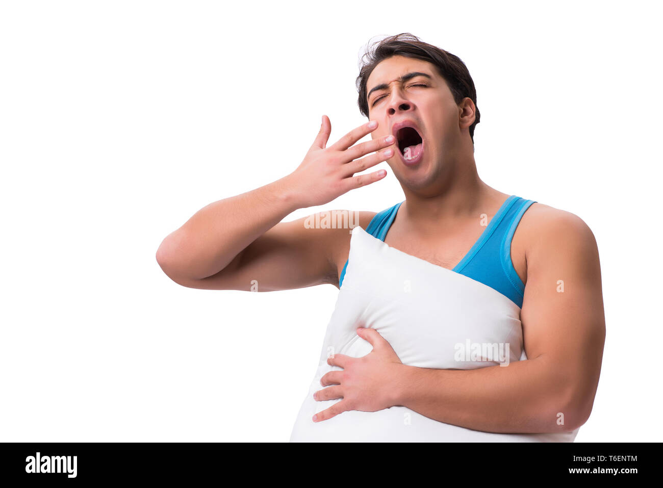 Junger Mann mit Kissen auf weißem Hintergrund Stockfoto