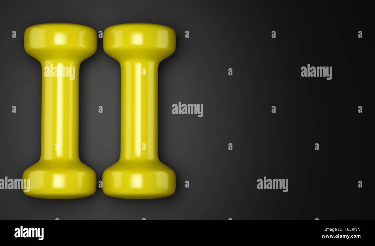 Gelbe Kurzhanteln auf schwarzem Hintergrund Stockfoto