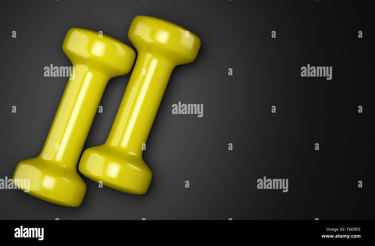 Gelbe Kurzhanteln auf schwarzem Hintergrund Stockfoto