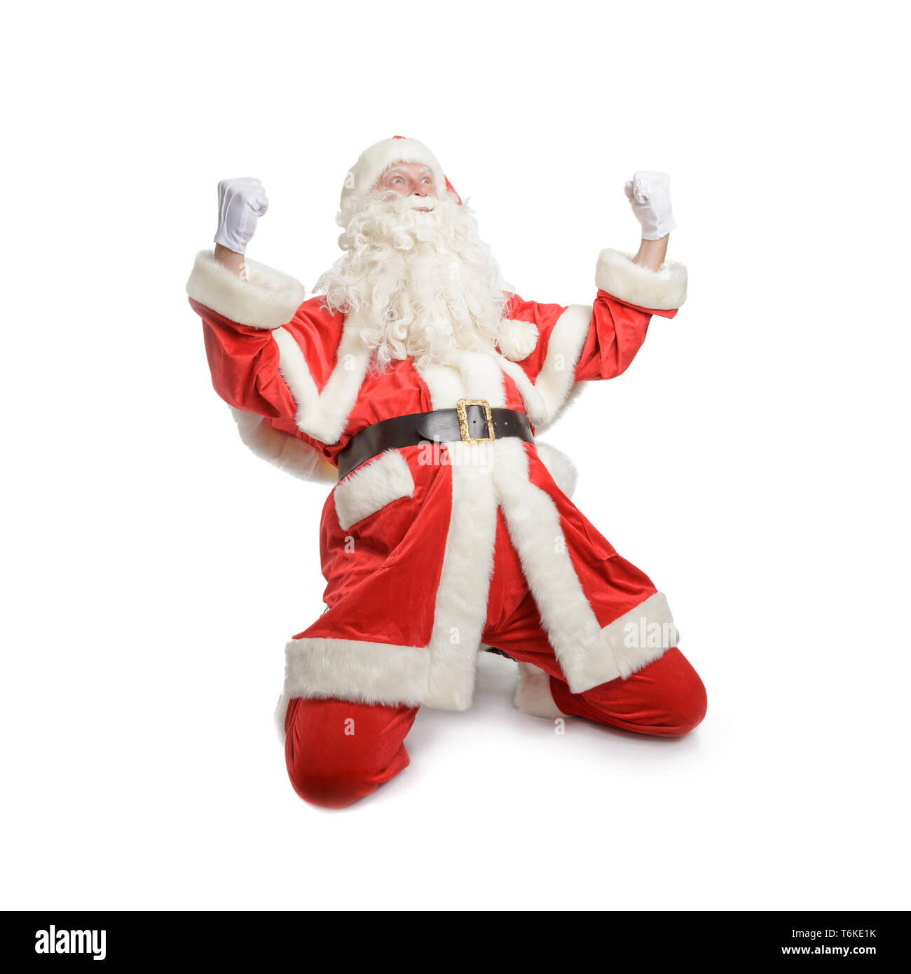Aufgeregt Santa Claus zujubeln. Auf weissem Hintergrund. Stockfoto