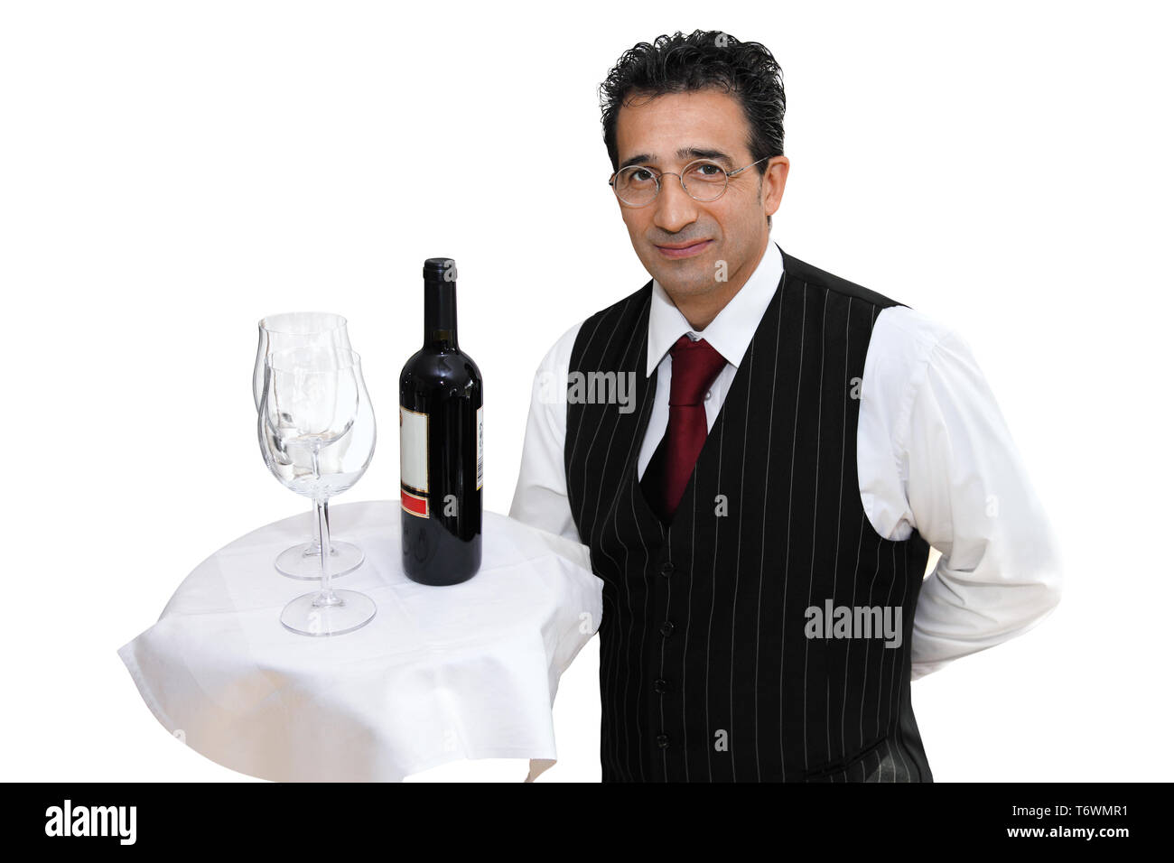 Kellner bieten Rotwein Stockfoto