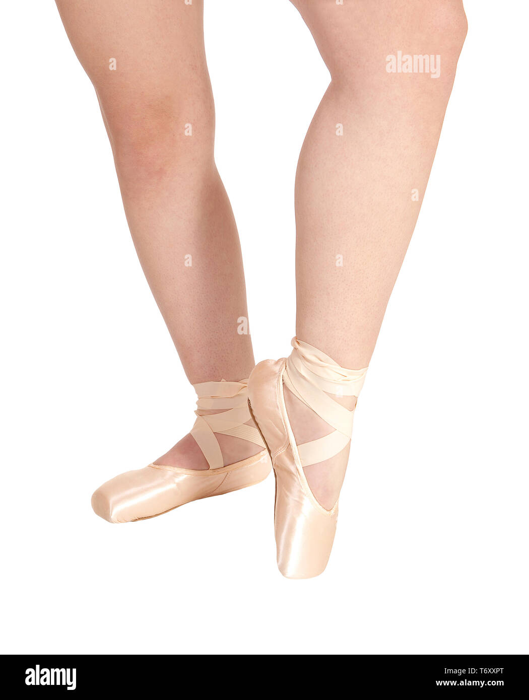 Die Beine eines Ballerina mit ihrem rosa Ballett Schuhe Stockfoto