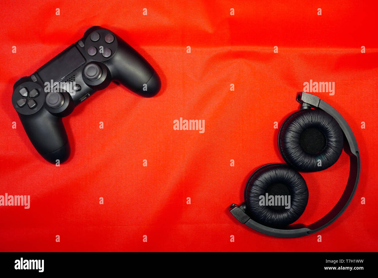 Zusammenklappbare Kopfhörer- und gamepad Vorlage Textur Hintergrund Stockfoto