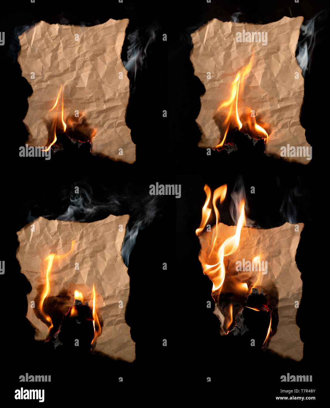 Brennende Stück zerknittertes Papier auf schwarzem Hintergrund Stockfoto