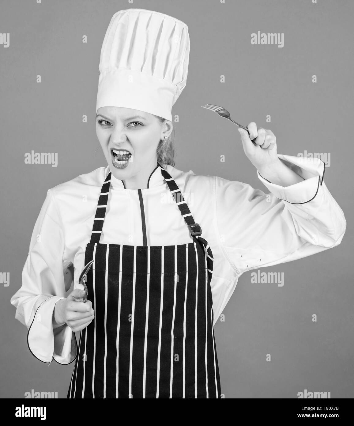 Koch kulinarische Schule. Kulinarische Kunst Akademie. Kulinarische Schule  Konzept. Frau Koch halten Besteck Löffel und Gabel. Zeit zu essen. Appetit  und Geschmack. Traditionelle kulinarische Stockfotografie - Alamy