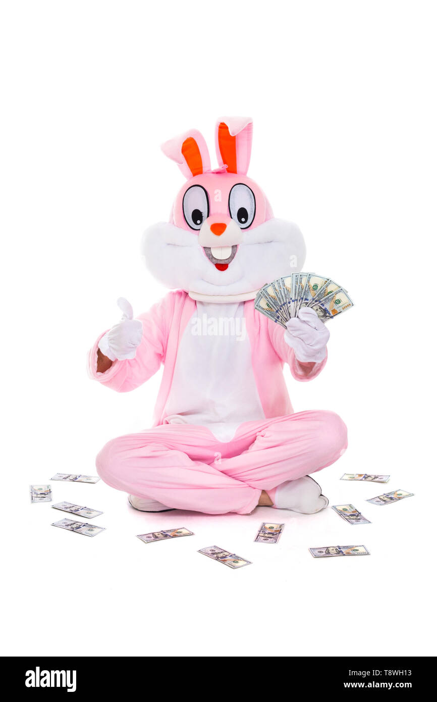 Osterhase Hase mit Fan von Dollar, feiert Ostern. Reich lucky Mann hält Geld Hundert-Euro-Scheine. Stockfoto