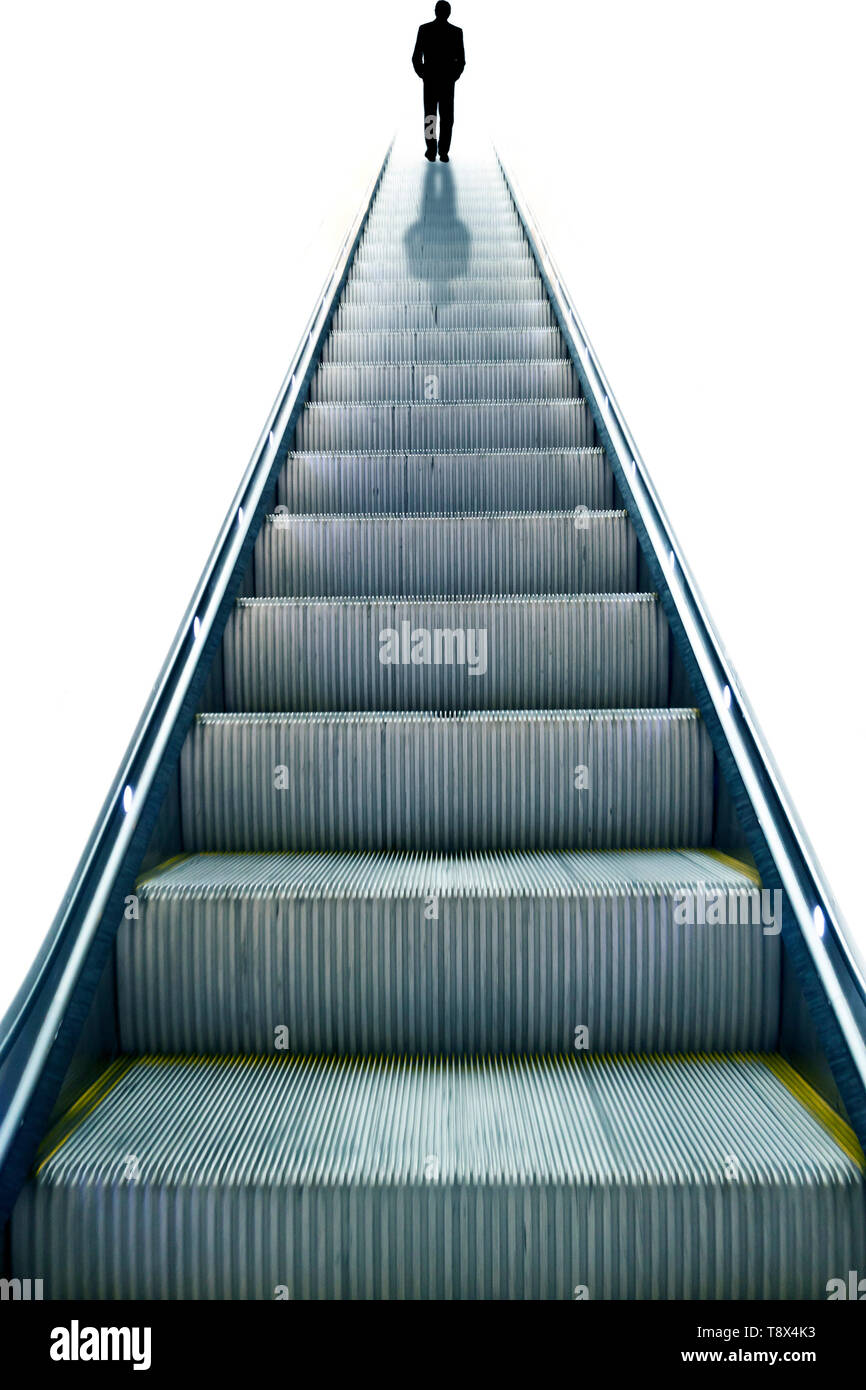 Silhouette von einem Mann in Anzug stehen am Rande einer Rolltreppe Stockfoto