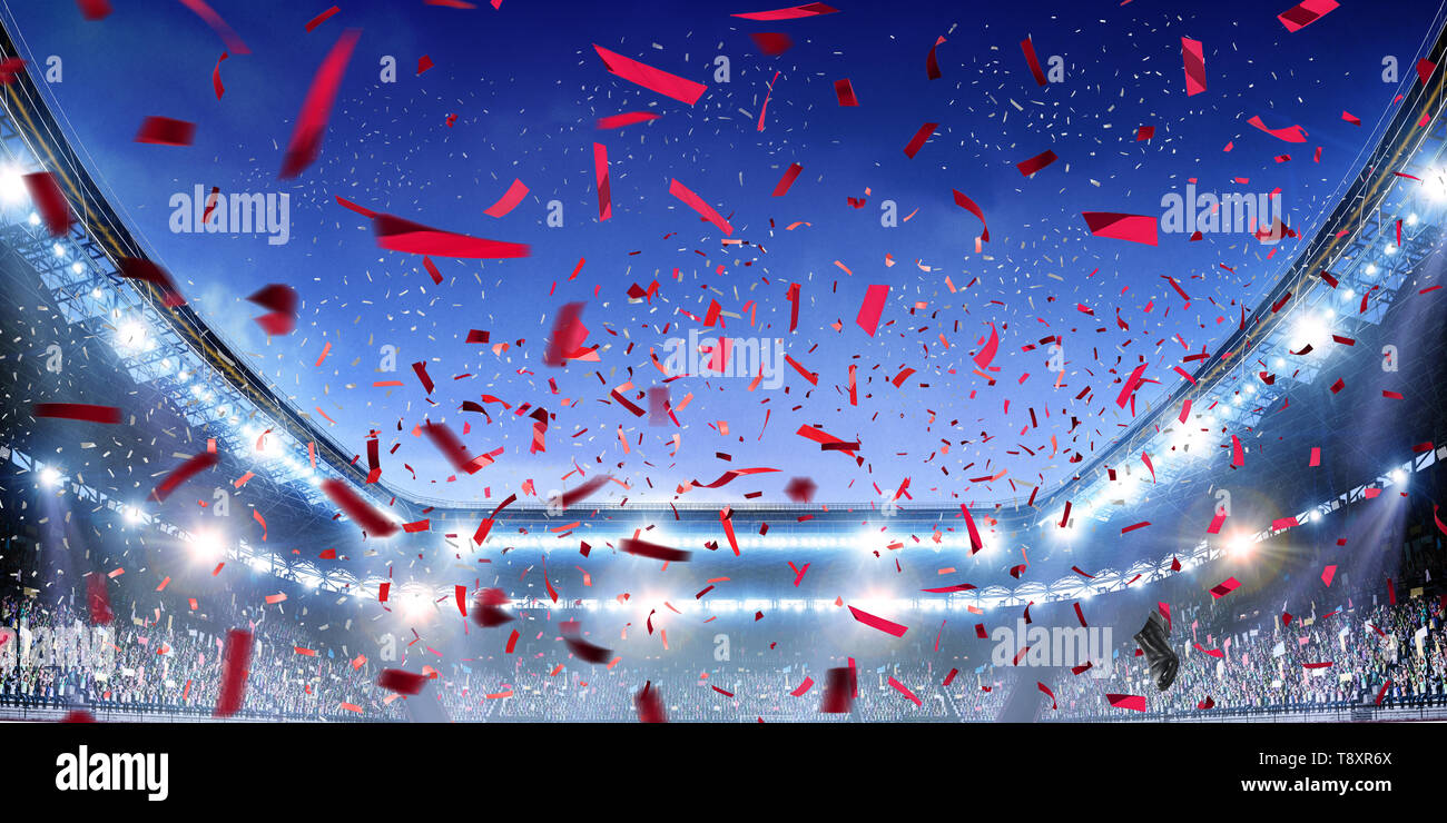 Fußballstadion Hintergrund mit fliegenden Konfetti Stockfoto