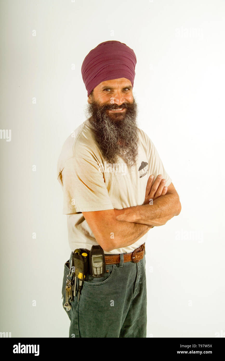 Ein turban tragende Sikhs railroad Wartung Arbeiter stellt auf der Los Angeles train Yards. Stockfoto