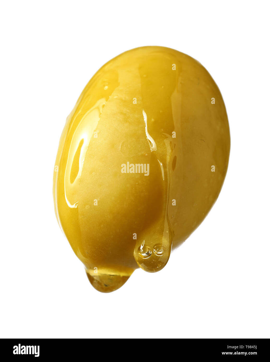 Öl tropft vom Olivenöl auf weißem Hintergrund Stockfoto