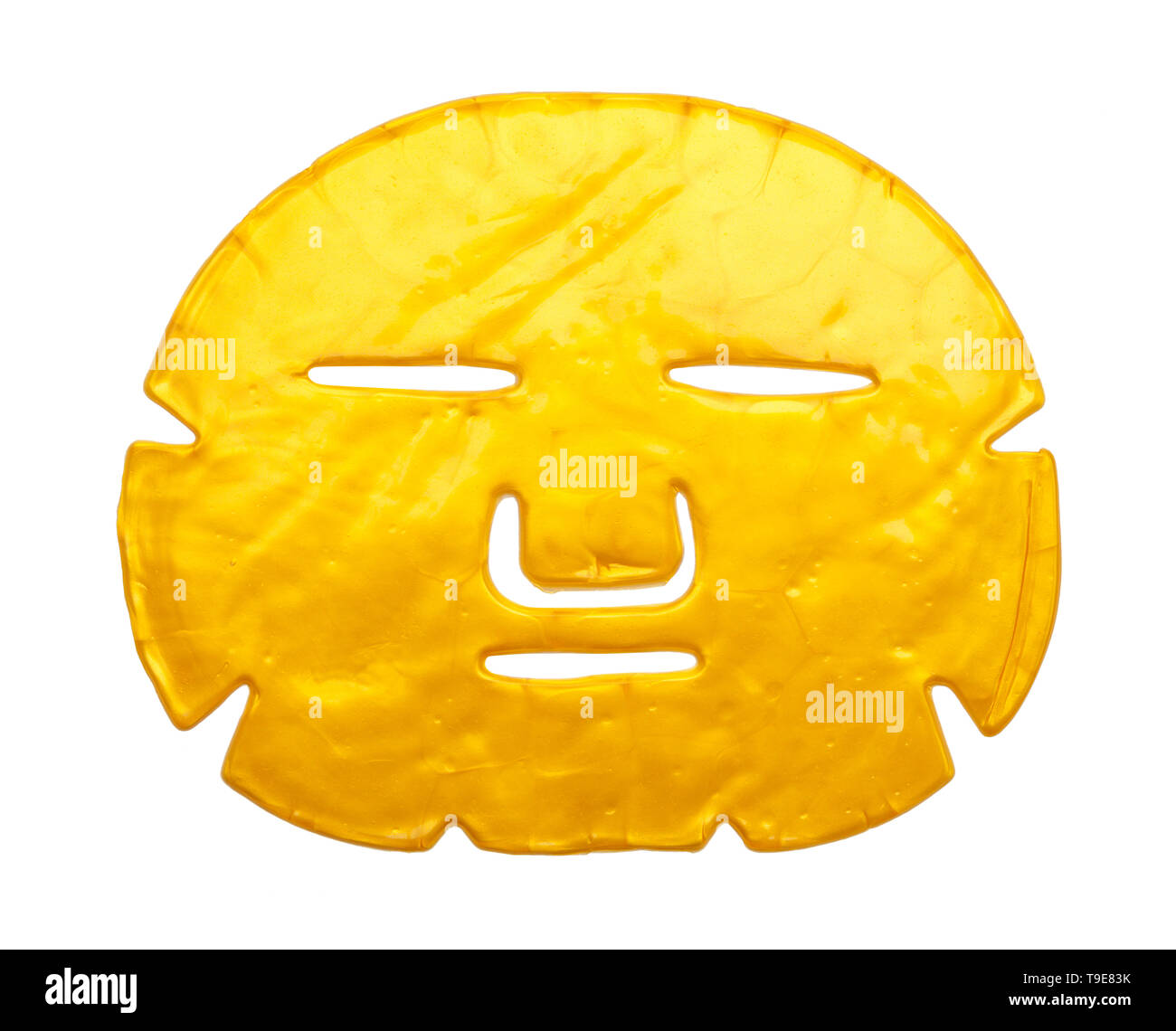 Gold Gesichtspflege Maske isoliert auf weißem Hintergrund. Stockfoto