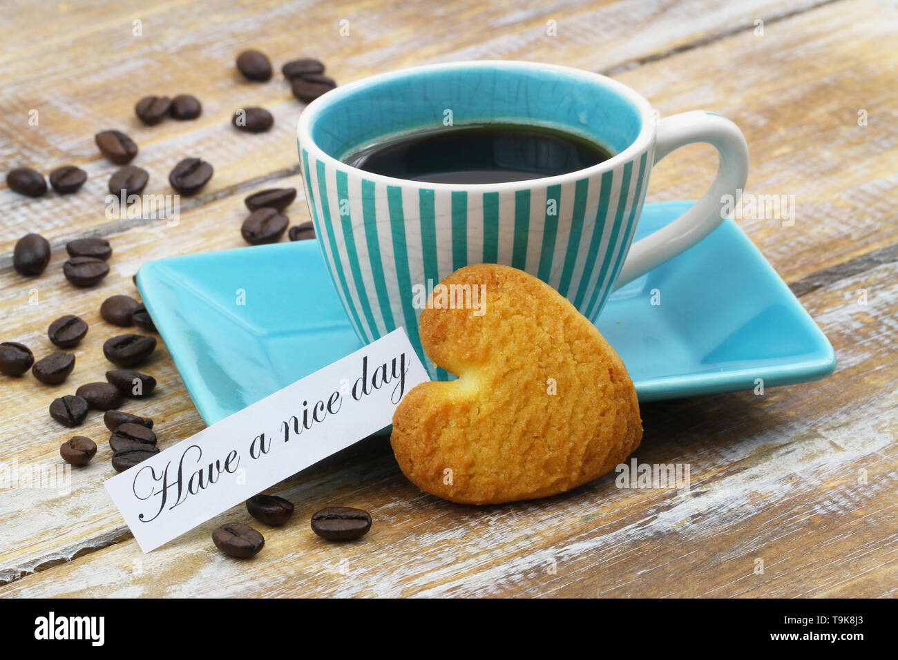 Einen schönen Tag noch Karte mit Tasse Kaffee und herzförmige Cookie Stockfoto