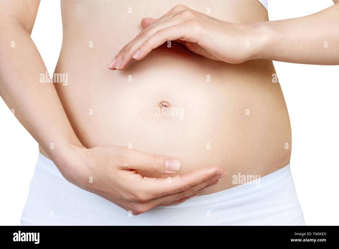 Schwangere Frau mit Bauch in den frühen Stadien der Schwangerschaft. Stockfoto