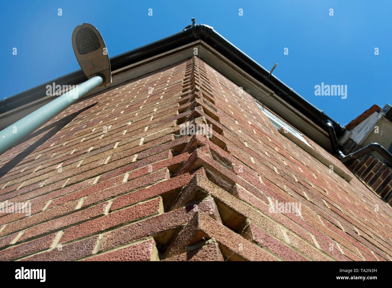 Dekorative Ecke Mauerwerk auf einem Gebäude in Barnes, London, England Stockfoto