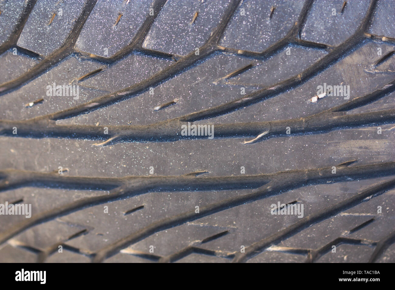 Ein Bild von einem close-up der Kerben an einem Auto Rad mit einigen Verschleiß und Verschmutzung Stockfoto