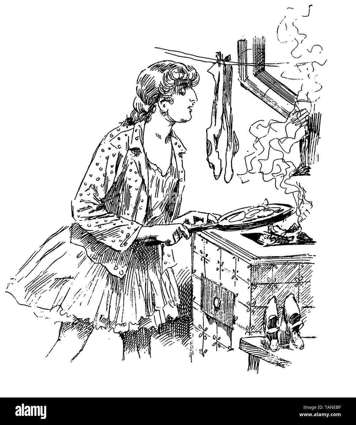 Junge Frau mit schlanken bedeutet Köche etwas zu Essen beim Trocknen Strümpfe und Schuhe in der Nähe von dem Herd. Stockfoto