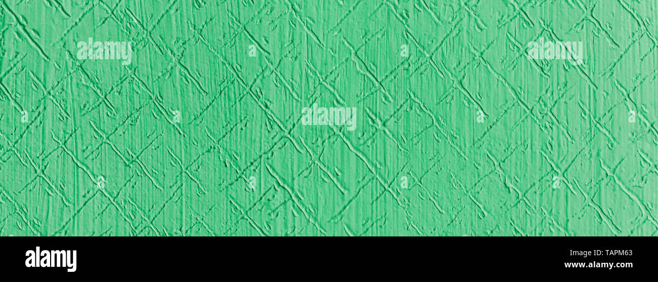 Grüne texturierte Wand detail. Abstrakte Retro-Stil mit Muster aus diagonal Kratzer. Breite - Engel nostalgische Hintergrund aus geprägtem Stuck Gips. Stockfoto
