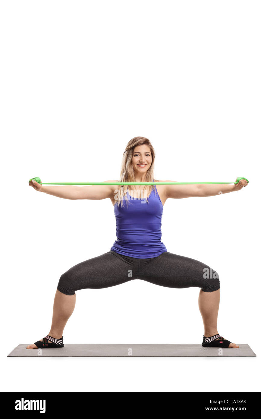 Gesunde junge Frau Training mit einem Stretching Gummiband auf weißem  Hintergrund Stockfotografie - Alamy