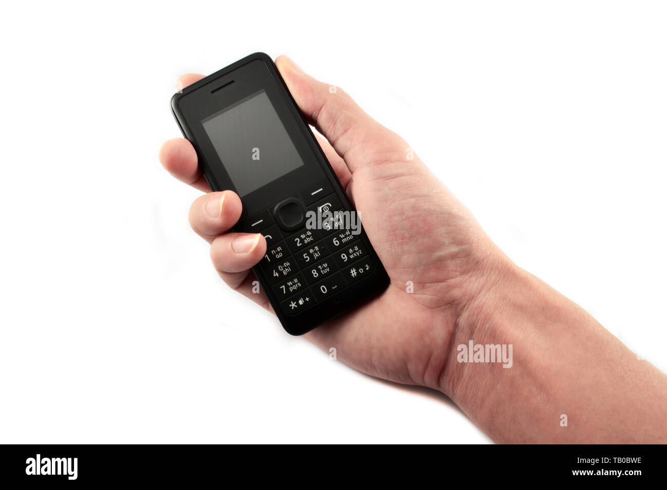 Telefon in der Hand/Altes Modell Handy auf weißem Hintergrund Stockfoto