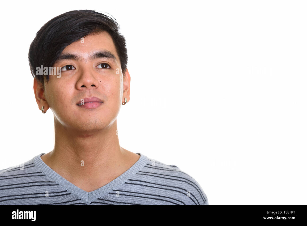 Studio geschossen von Stattlichen asiatischer Mann denken Stockfoto