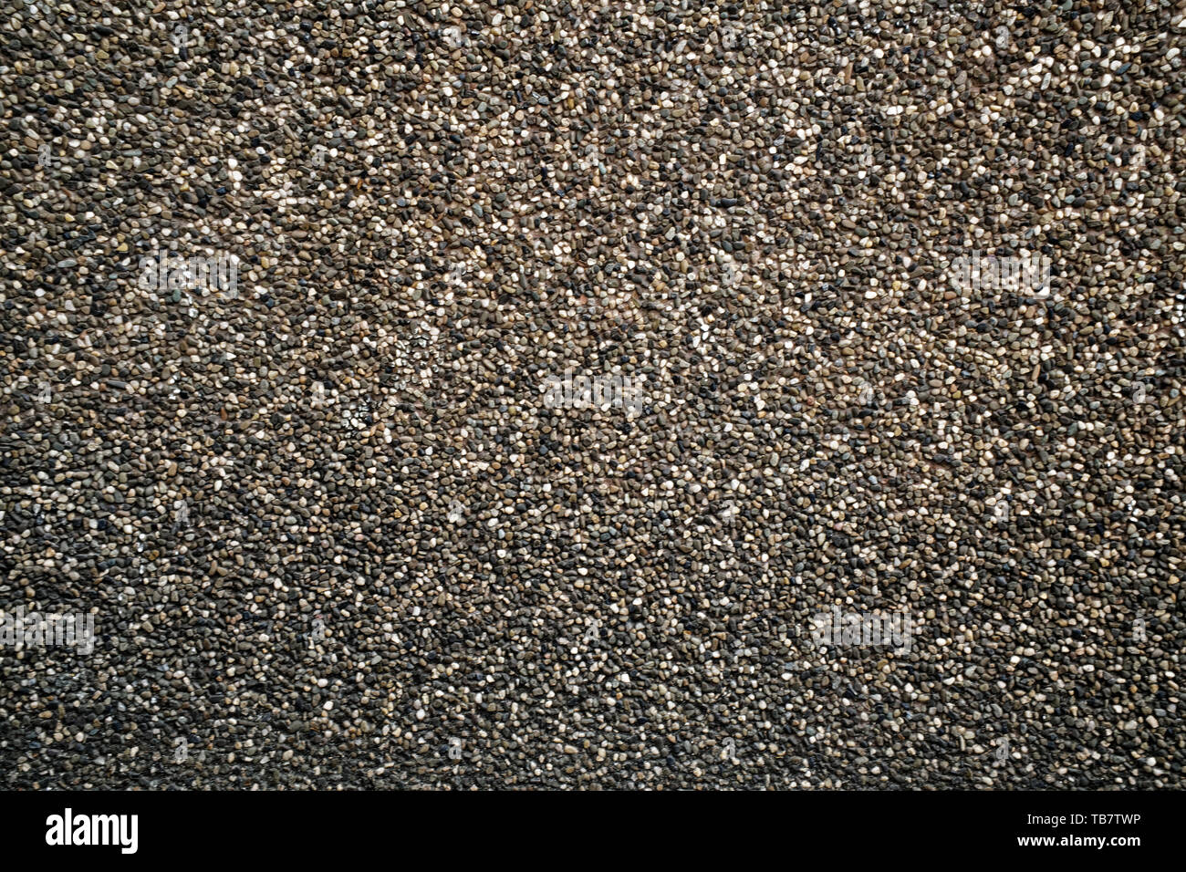 Kleine braune Steine erstellen schönes Muster, Kies Textur. Stockfoto