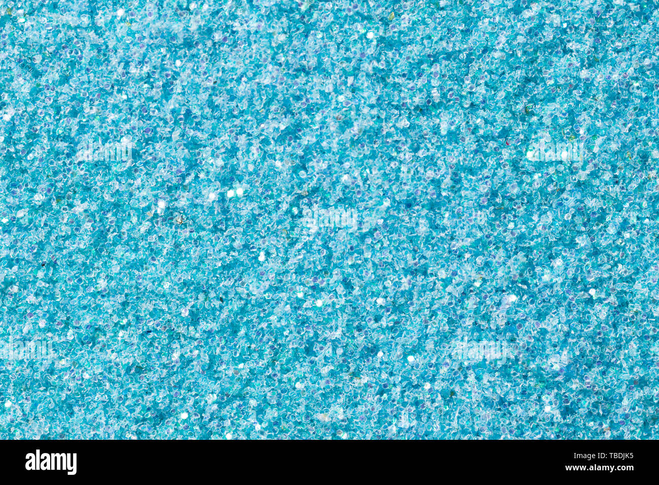 Sanften hellblauen Hintergrund mit Glitzer auf Makro. Hochauflösendes Foto. Stockfoto