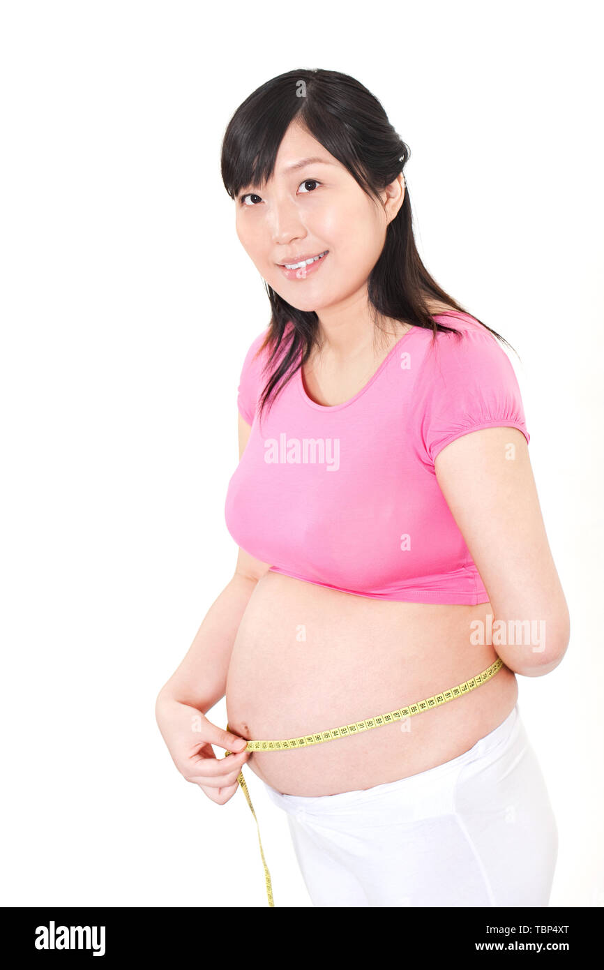 Eine schwangere Frau funktioniert. Stockfoto