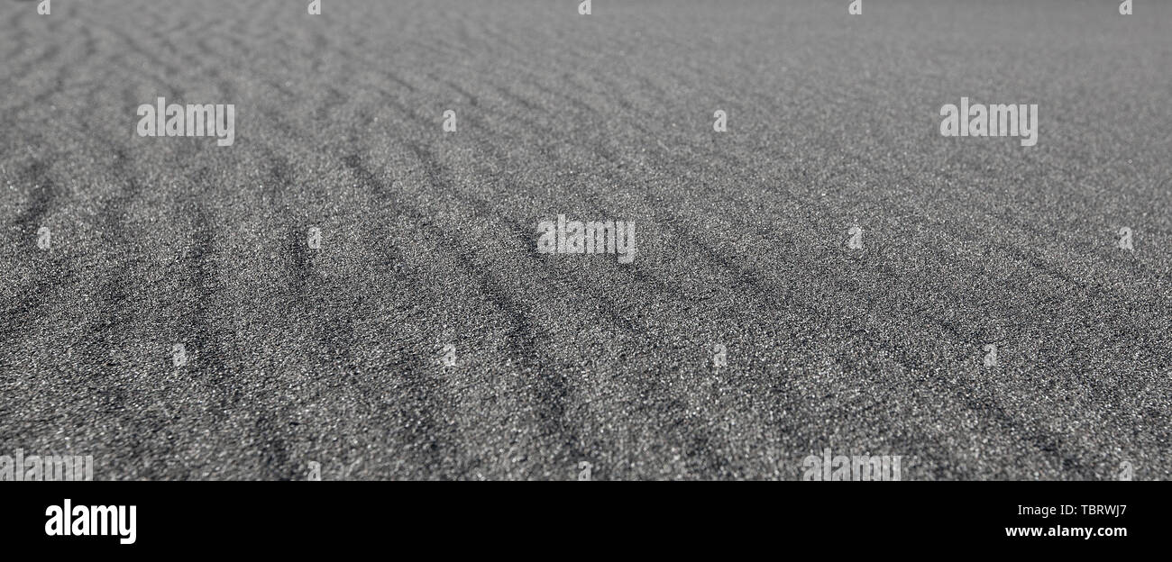 Schwarzen Sand Wellen als Hintergrund Stockfoto