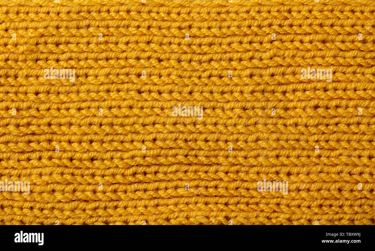 Gelb gestrickte Wolle Textur Hintergrund Muster mit hoher Auflösung. Ansicht von oben. Kopieren Sie Platz. Stockfoto